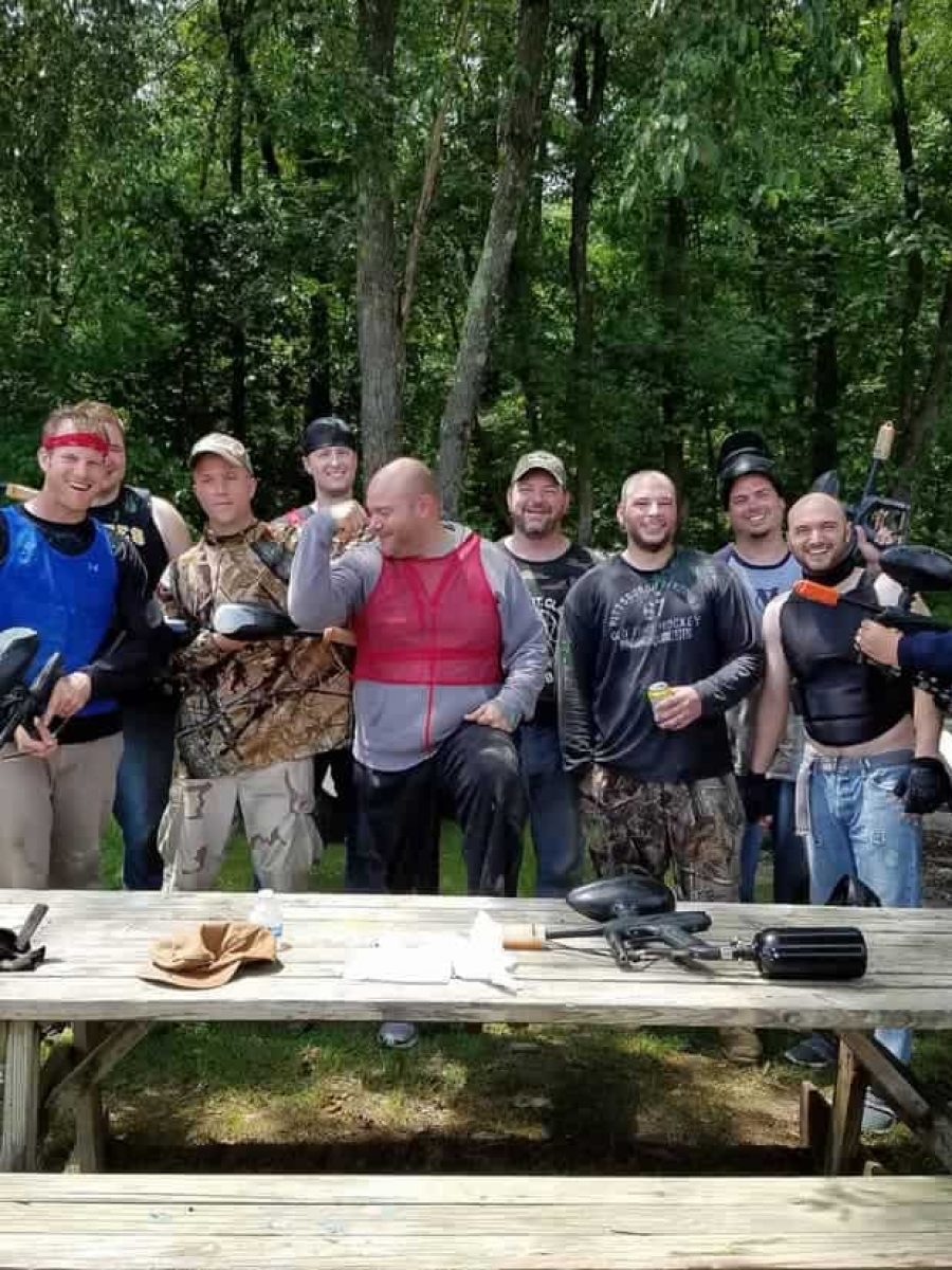 group of guys at company paintball outing